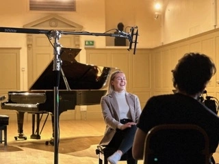 Elise being filmed for a documentary